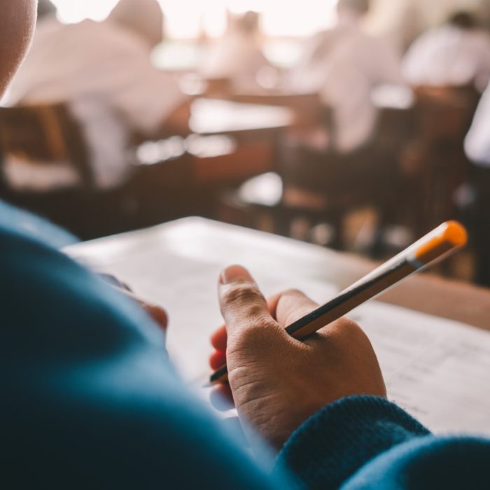 Student reading and taking exam with stress