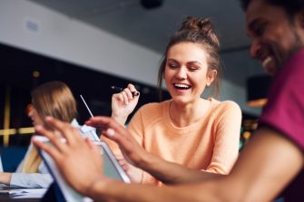 Happy business couple sharing private information 