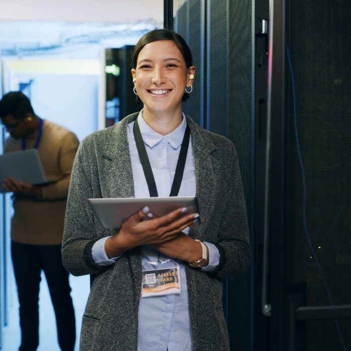 Server room, portrait and woman technician with tablet for cybersecurity, update and machine system. IT support, data center and smile of engineer for network, information technology and solution.
