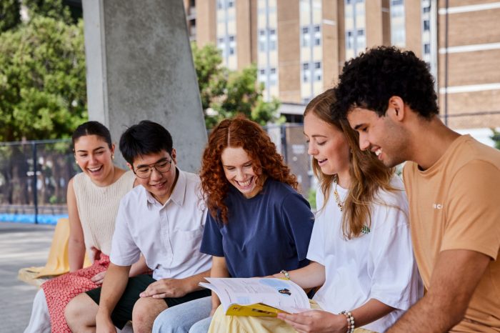 Students sitting together outside