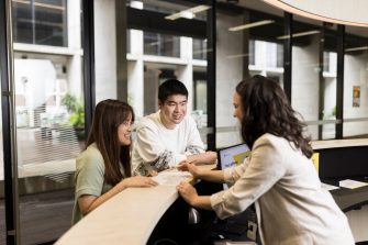 Student Services helping students at desk