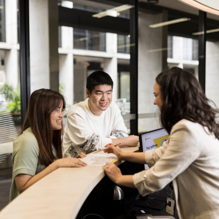 Student Services helping students at desk