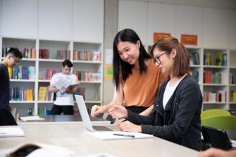 Students studying with books and laptops in the Library Support Unit (LSU)