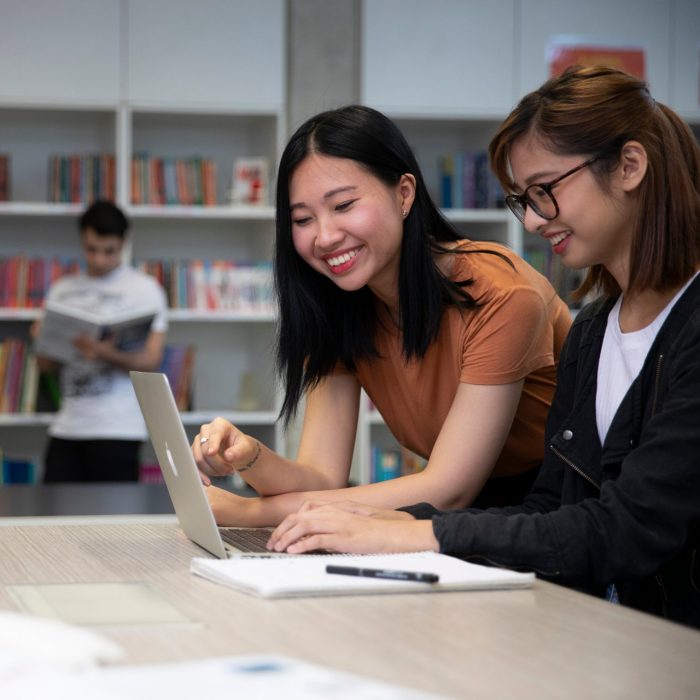 Students studying with books and laptops in the Library Support Unit (LSU)