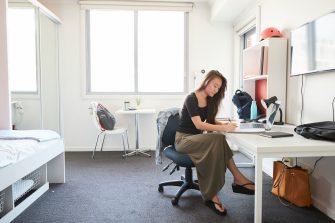 Student studying at the desk in their student accommodation