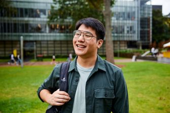 Beautiful UNSW College Student standing outside on the main walkway, solo student